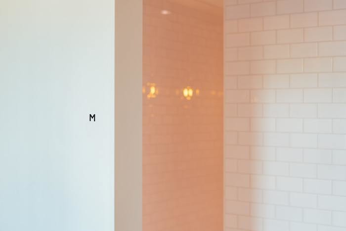 scrubbed tiles on men's bathroom